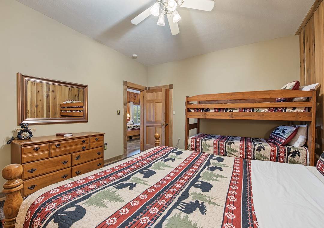 Rustic wood furnishings and charming wildlife-print bedding create a cozy retreat where your family can unwind after a day of adventure, with plenty of room for everyone to settle in comfortably.