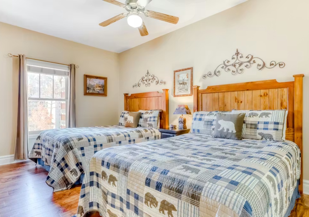 Cozy up in your charming twin bedroom with rustic charm and peaceful forest views through your window.