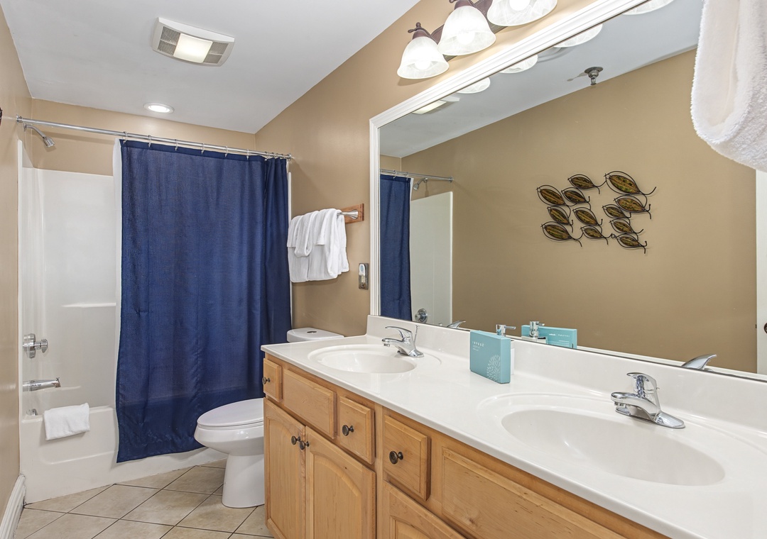Your spacious bathroom features dual sinks and a relaxing tub-shower combo for refreshing starts to your vacation days.