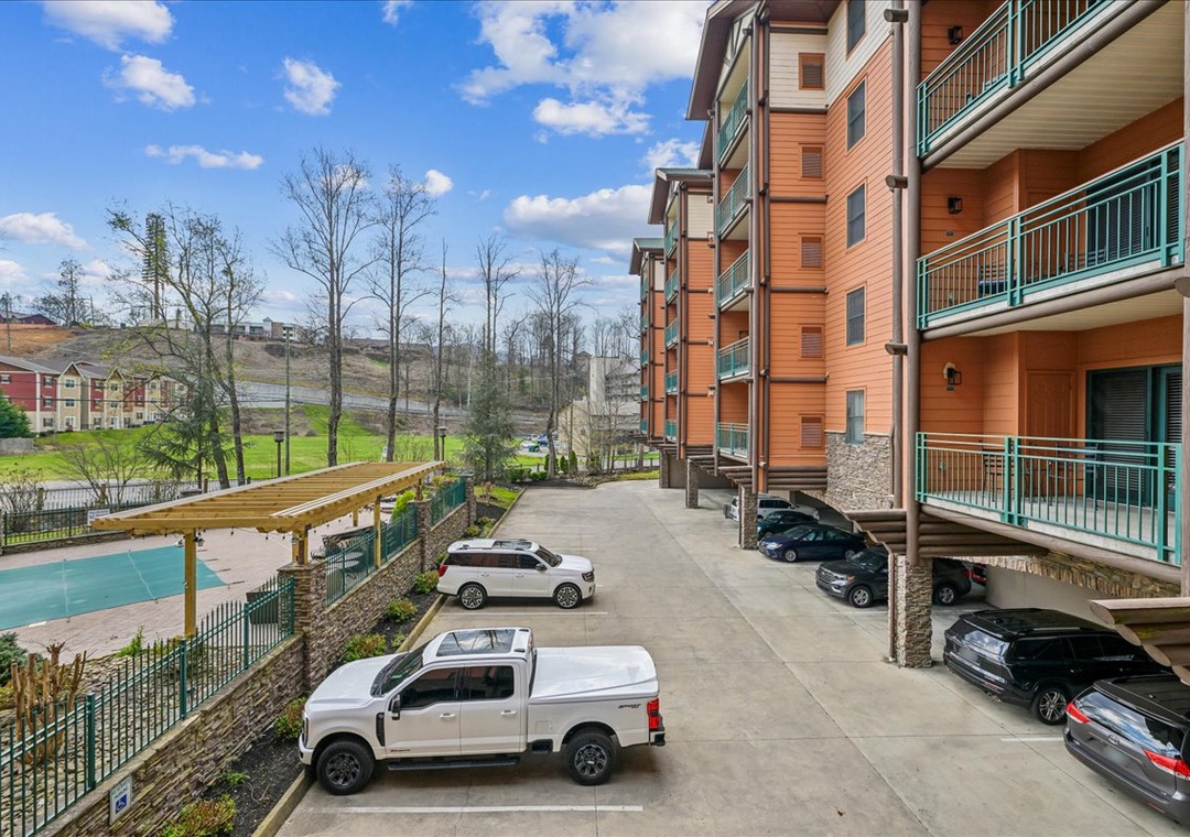 Modern mountain resort complex with convenient parking and scenic surroundings for a peaceful getaway.