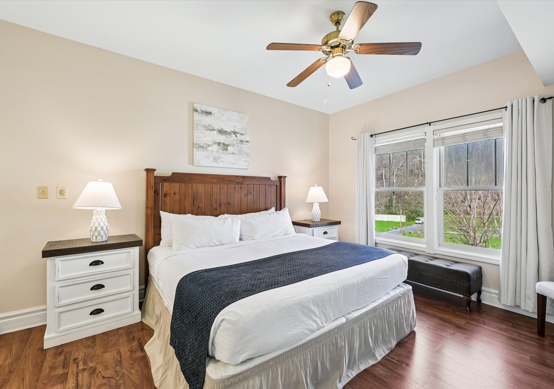 Drift off to sleep in your cozy bedroom with crisp linens, warm wood touches, and peaceful garden views from your window.