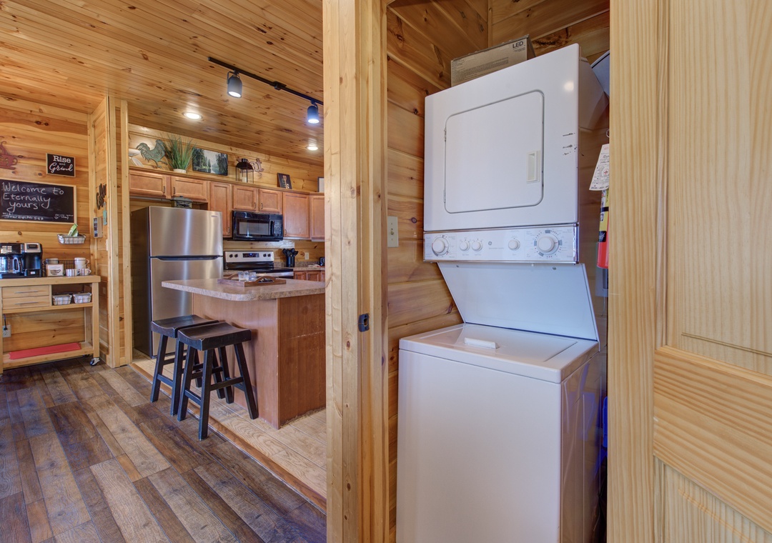 Your cabin features a convenient stacked washer-dryer combo just steps from the full kitchen—perfect for keeping your wardrobe fresh throughout your stay.