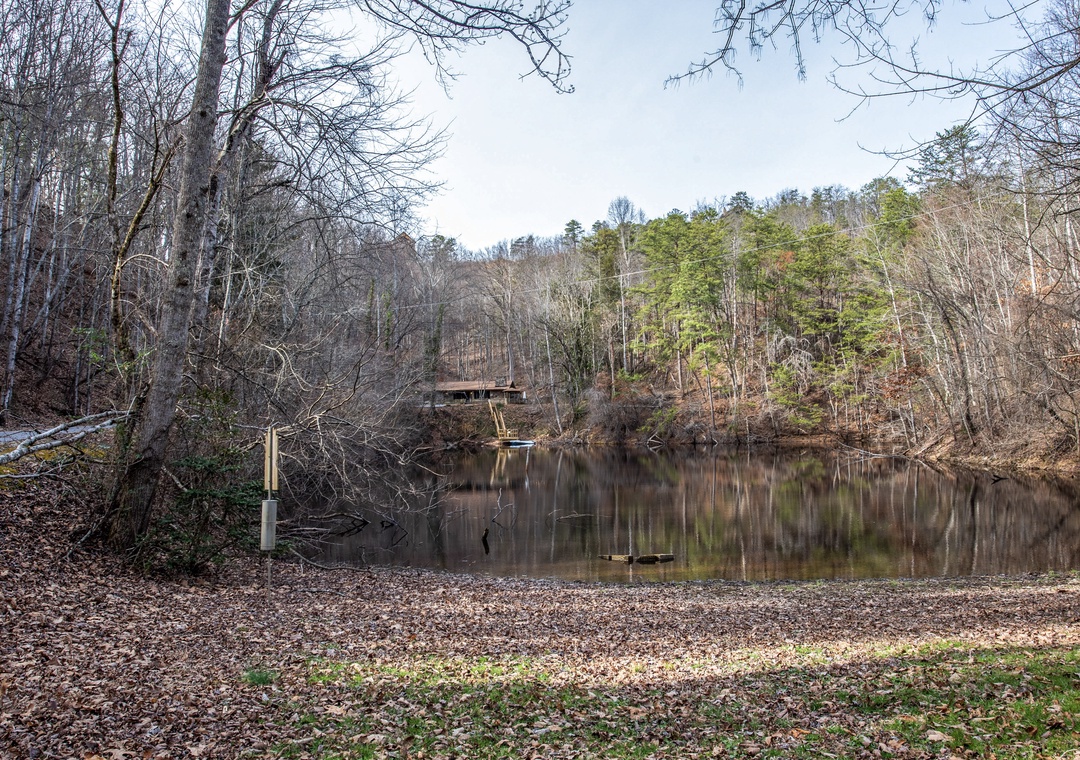 Peaceful lake surrounded by wooded hills offers a tranquil natural setting near the property.