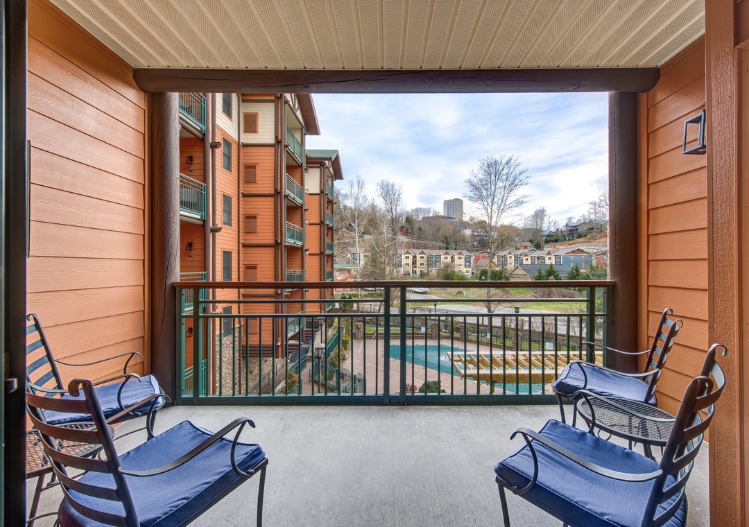 Step onto your private balcony where comfortable seating awaits your morning coffee moments with urban views stretching beyond.