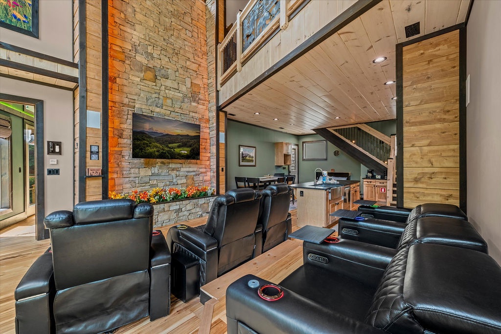 Settle into plush theater seating and soak in the warmth of the stone fireplace while the stunning mountain view on the TV invites you to unwind completely.