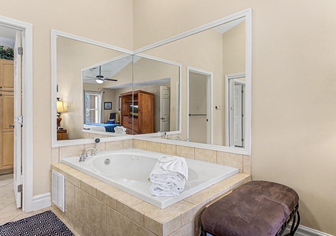 Unwind in your own luxurious soaking tub, complete with soft towels and a romantic view into the bedroom.