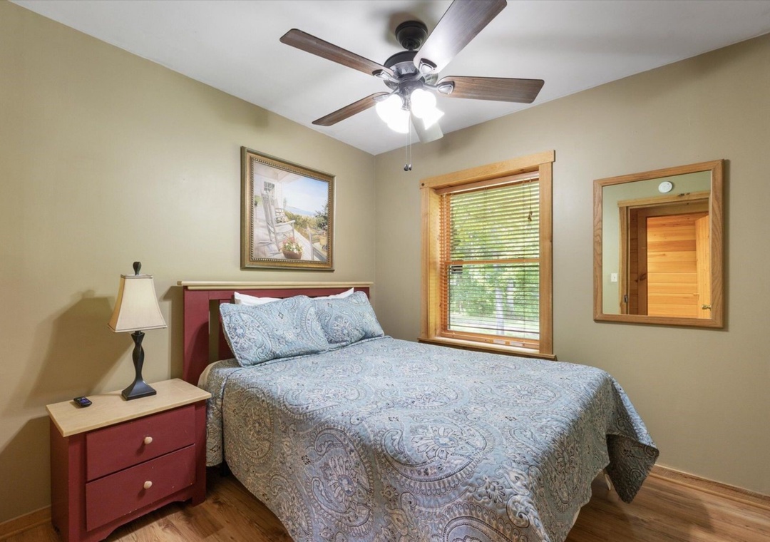 Your cozy bedroom features warm wood floors, soothing natural light, and a peaceful atmosphere perfect for restful nights.