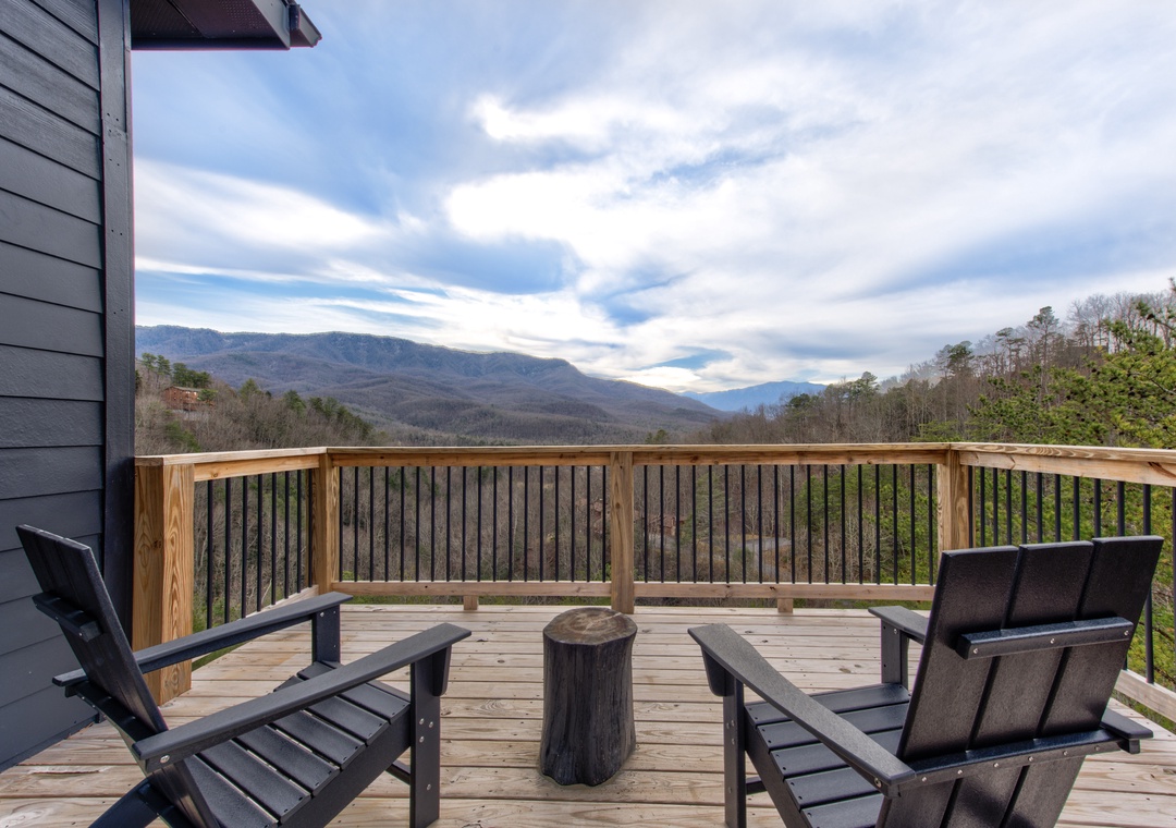 Settle into comfortable deck chairs and soak up sweeping mountain vistas from your private balcony retreat.