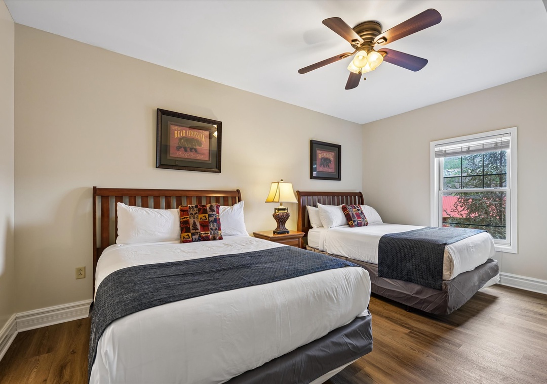 Unwind in your comfortable twin bedroom with rustic charm and crisp linens that promise peaceful mountain dreams.