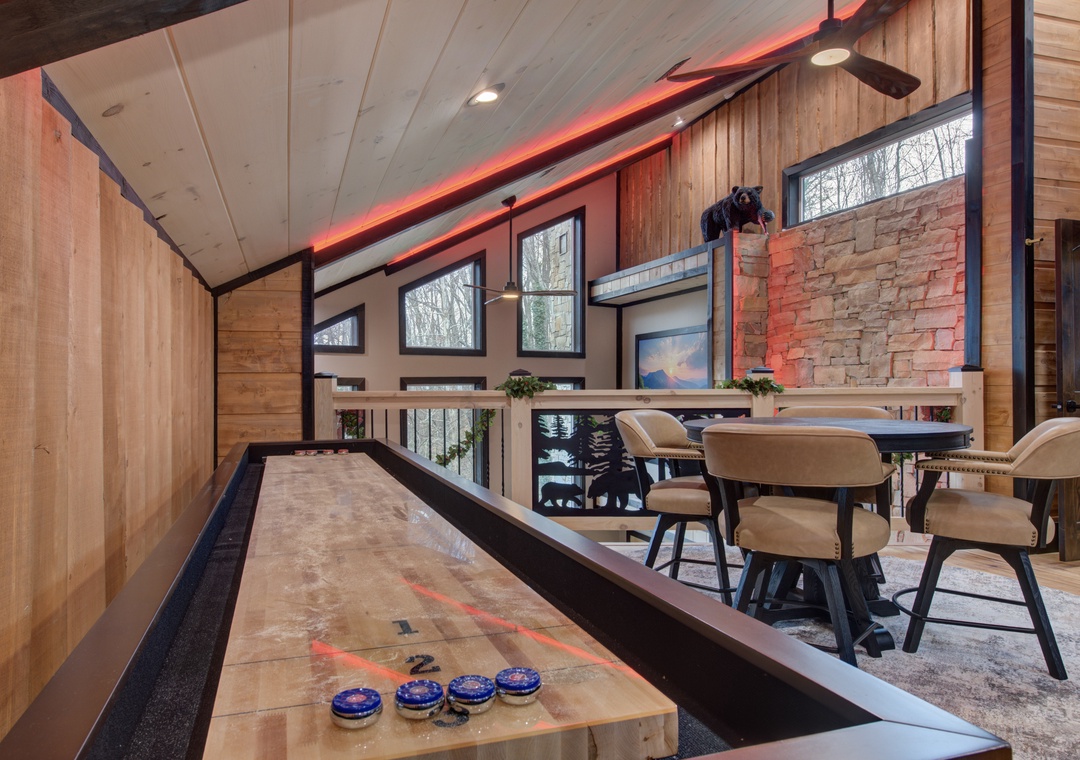 Enjoy your own private shuffleboard court in this stunning game room, perfect for friendly competition after dinner.