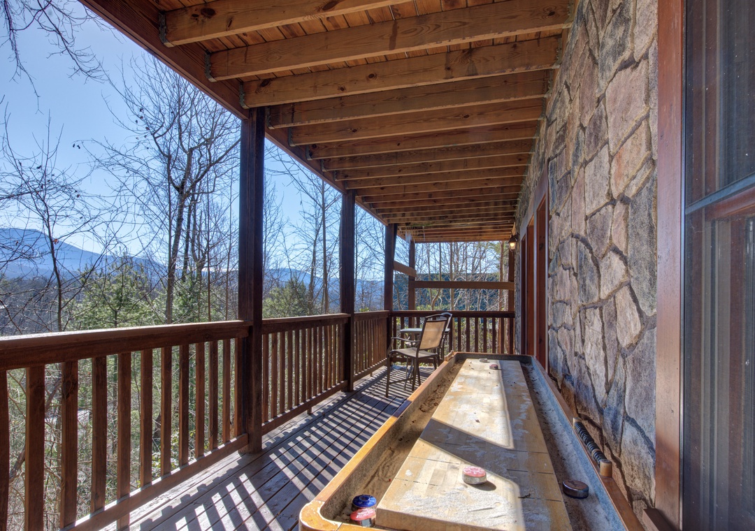 Unwind on your private covered deck with stunning mountain views, complete with shuffleboard for entertainment.