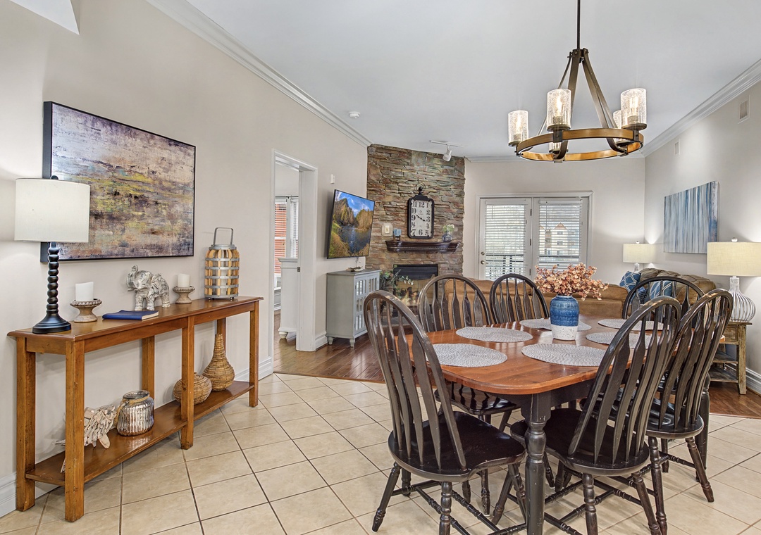 Gather around this inviting dining space where warm wood tones and rustic charm create the perfect setting for your memorable meals together.