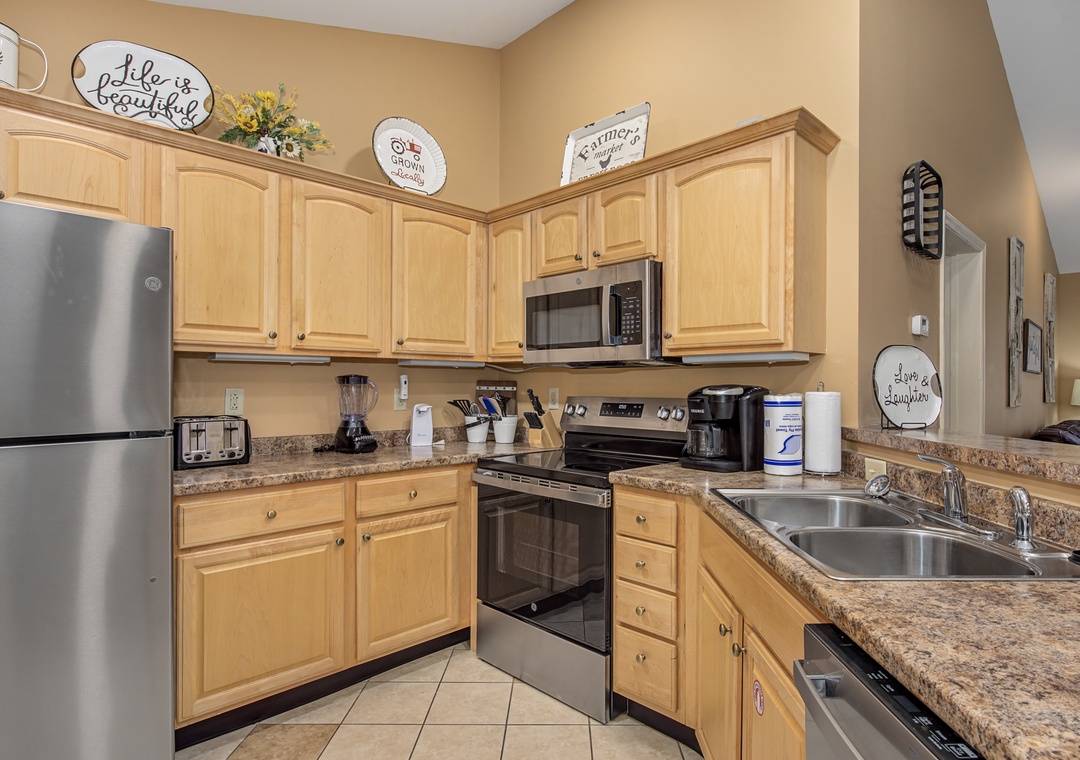 Your fully equipped kitchen features modern appliances and warm wood cabinets, perfect for preparing meals during your stay.