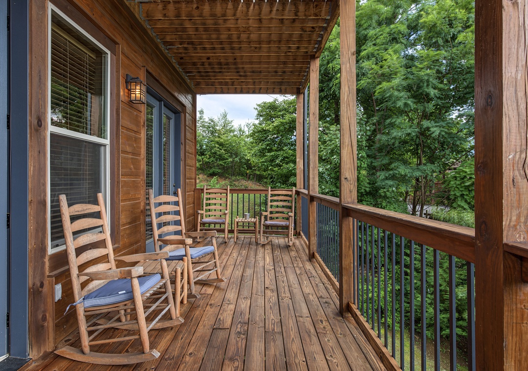Picture yourself rocking gently in your chair as you sip morning coffee, surrounded by towering trees and fresh mountain air—your private retreat awaits.