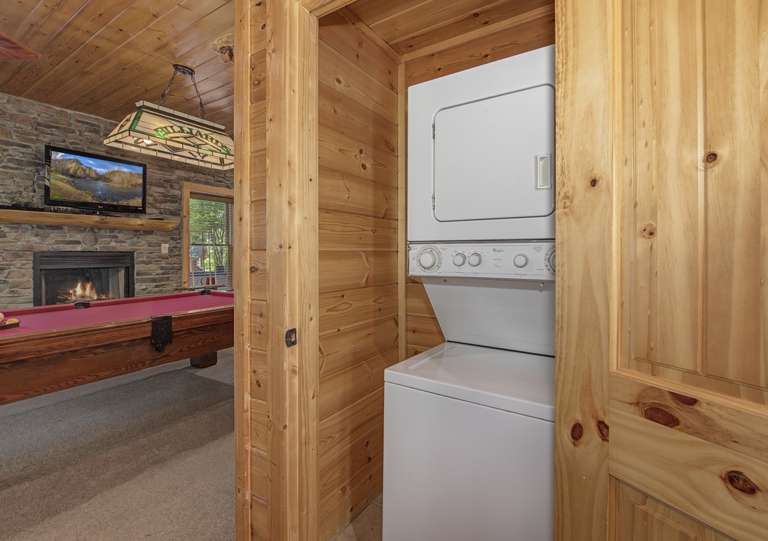 Convenient laundry facilities keep your mountain getaway comfortable, with warm wood surroundings and nearby game room for entertainment.