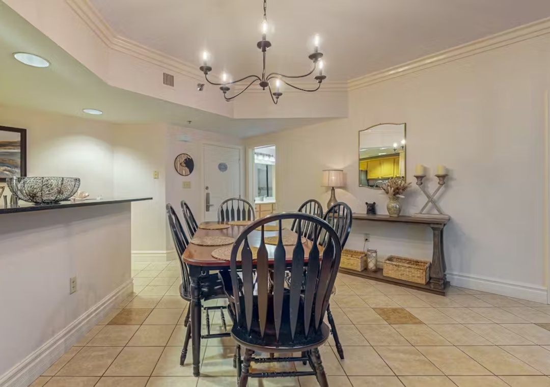 Your elegant dining space features classic Windsor chairs and warm lighting, perfect for memorable meals with loved ones.