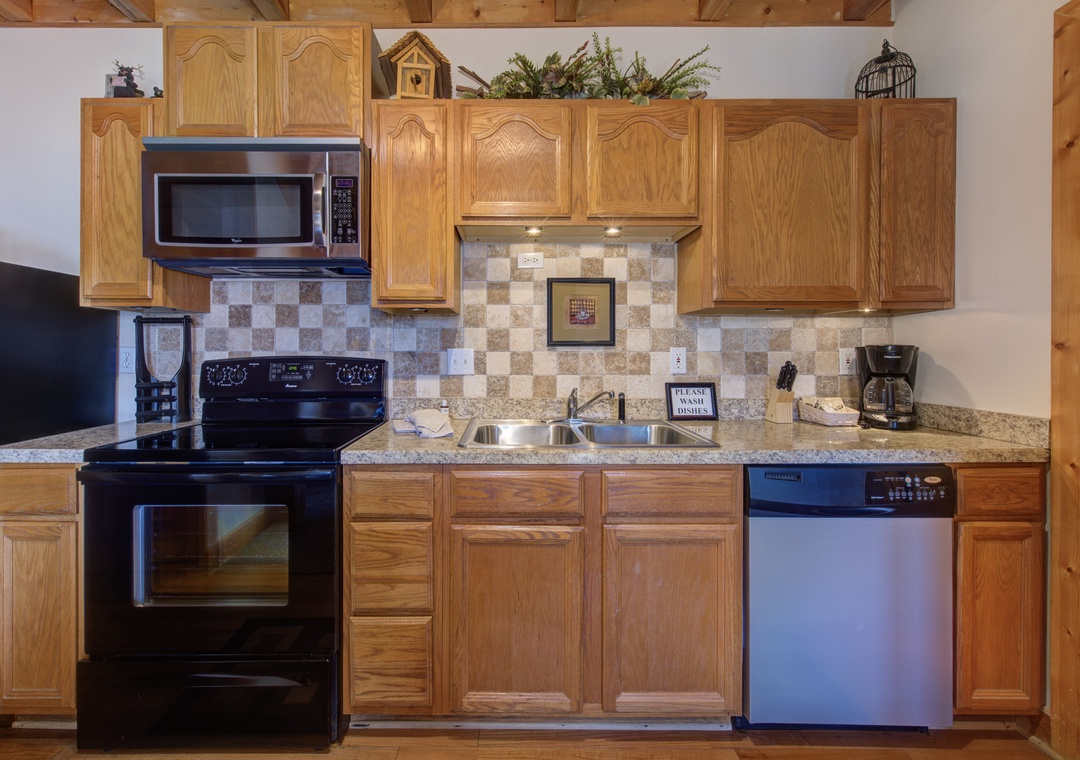 Cook your favorite meals in this fully-equipped kitchen with granite counters, stainless appliances, and charming rustic wood cabinets.