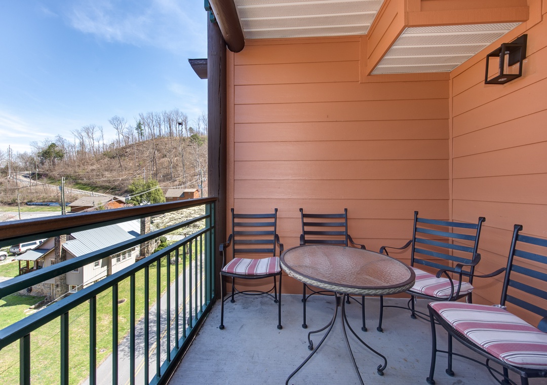 Unwind on your private balcony with mountain views, perfect for morning coffee or evening relaxation with comfortable seating.