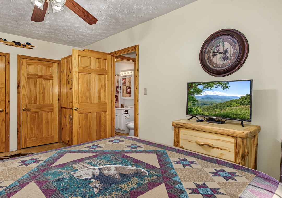 Settle into your cozy retreat with charming rustic touches and all the comforts you need. The adjoining bathroom adds convenience, while the ceiling fan keeps you comfortable year-round.
