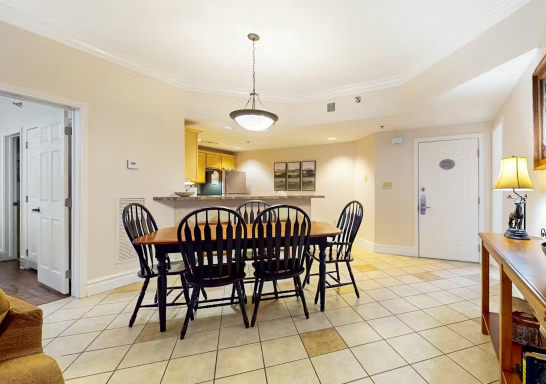 Gather around your spacious dining table for memorable meals with loved ones in this bright, open living space.