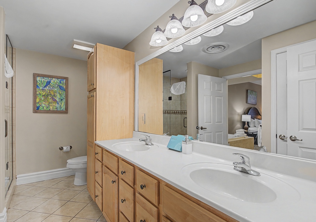 Freshen up in your spacious master bathroom with dual vanities, ample storage, and modern fixtures for your comfort.