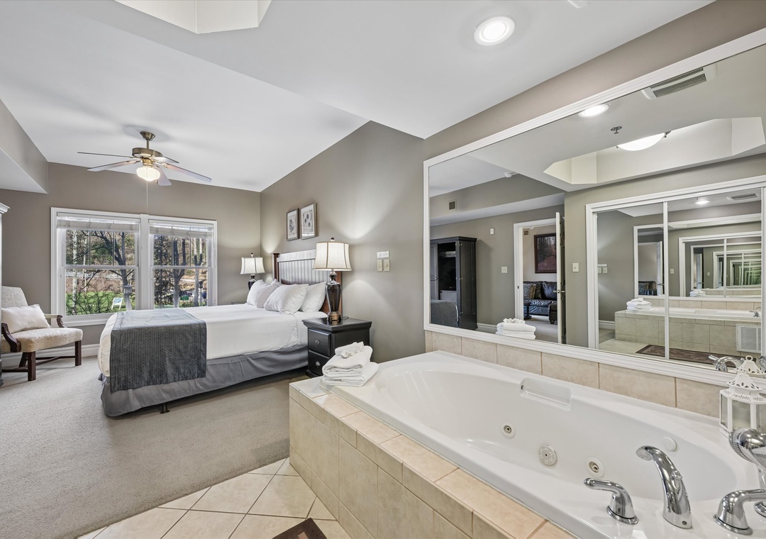 Unwind in your spacious master suite featuring a luxurious jetted tub where you can soak away stress while enjoying views of the bedroom.