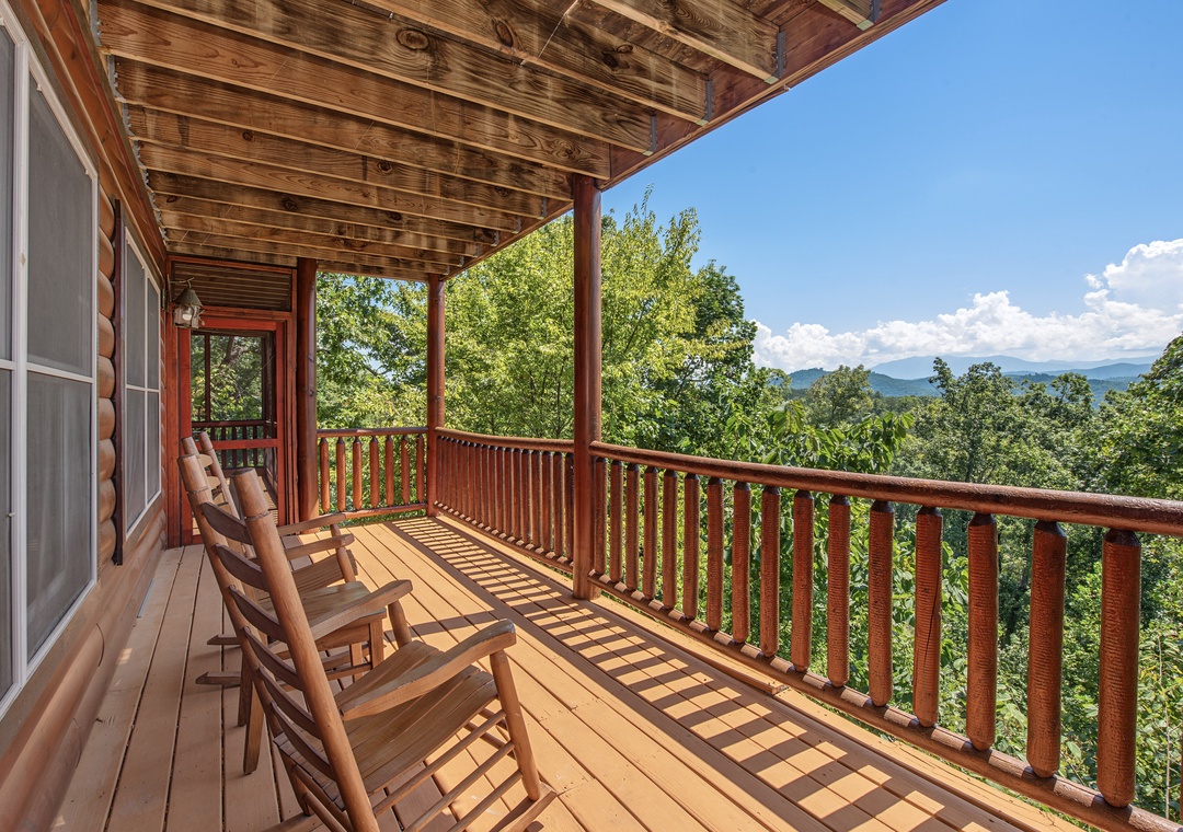 Relax in your rocking chair and soak in breathtaking mountain views framed by lush greenery, all from the comfort of your own private balcony.