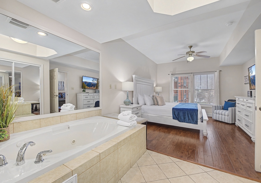 Unwind in your luxurious master suite featuring a romantic jetted tub overlooking your cozy bedroom sanctuary.