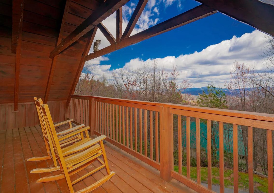 Relax in your rocking chairs while taking in sweeping mountain views from your private covered balcony.