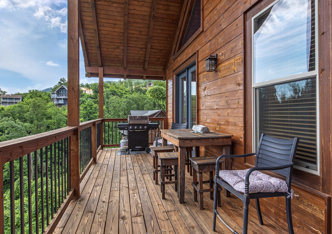 Step onto your private covered balcony, where morning coffee and evening barbecues become cherished rituals. Surrounded by lush greenery and mountain views, this cozy outdoor space invites you to unwind.