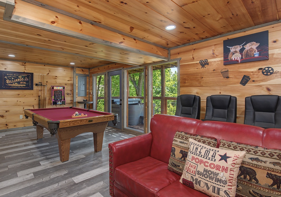 Gather in your private game room with knotty pine ceilings, a full-size billiard table, theater seating, and forest views—perfect for friendly competition and movie nights.