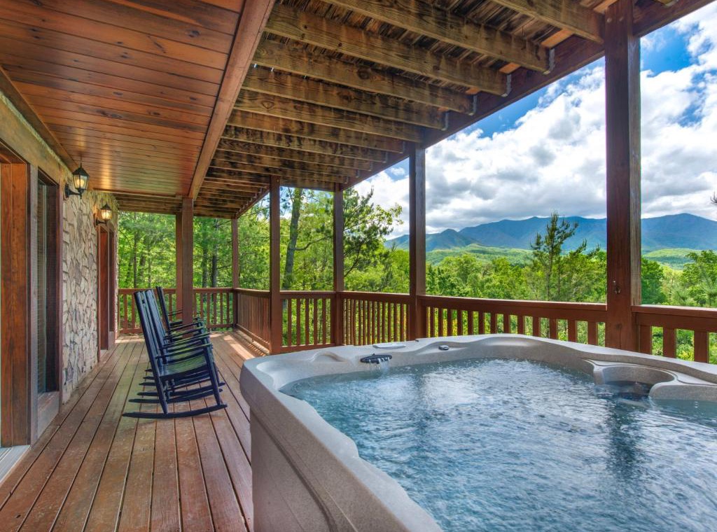 Unwind in your private hot tub while taking in breathtaking mountain views from the spacious covered deck.