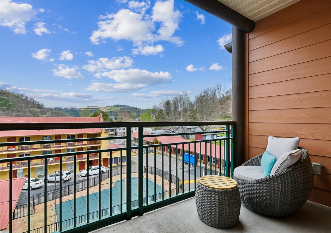 Relax on your private balcony with wicker seating and stunning countryside views stretching to rolling hills.