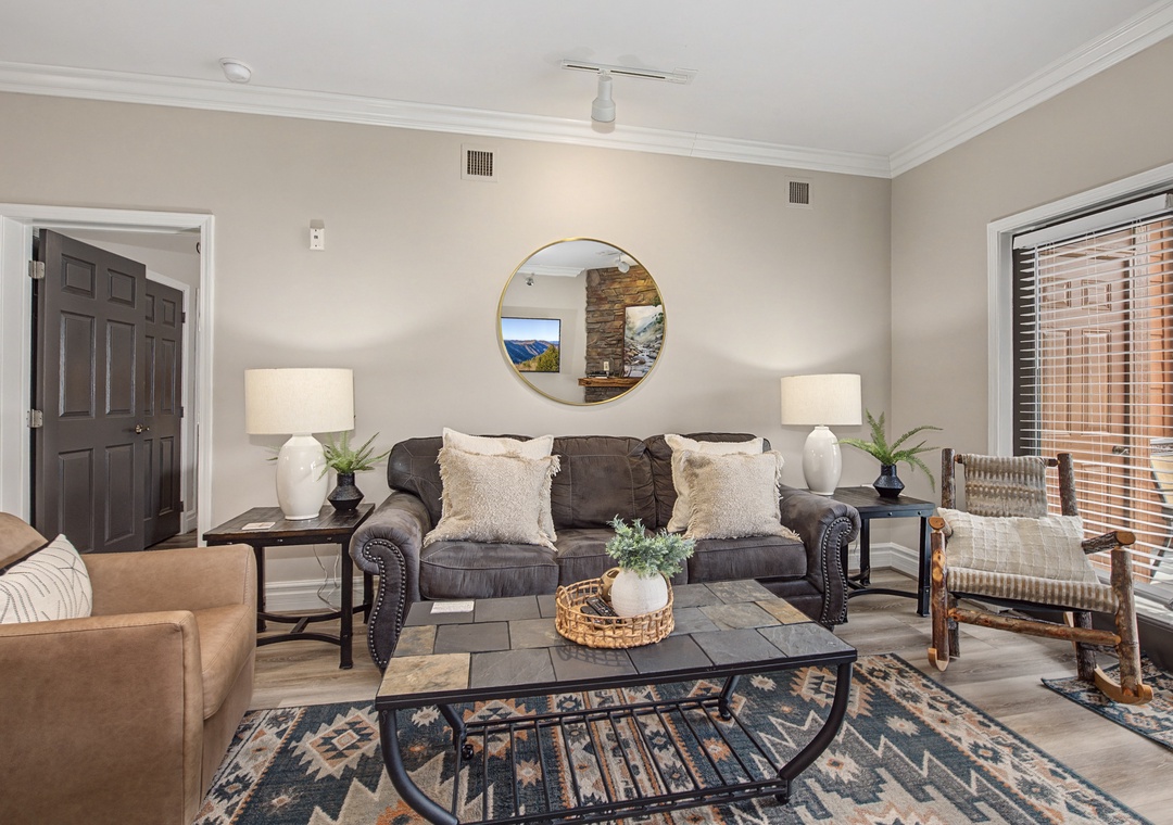 Sink into plush seating in your thoughtfully designed living room, where warm lighting and curated decor create the perfect space to unwind.