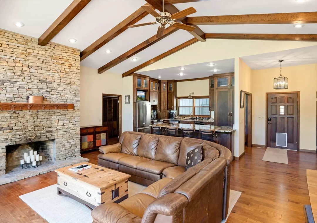 Relax in your spacious open-concept retreat, where rustic beams and stone fireplace create the perfect atmosphere for memorable evenings together.
