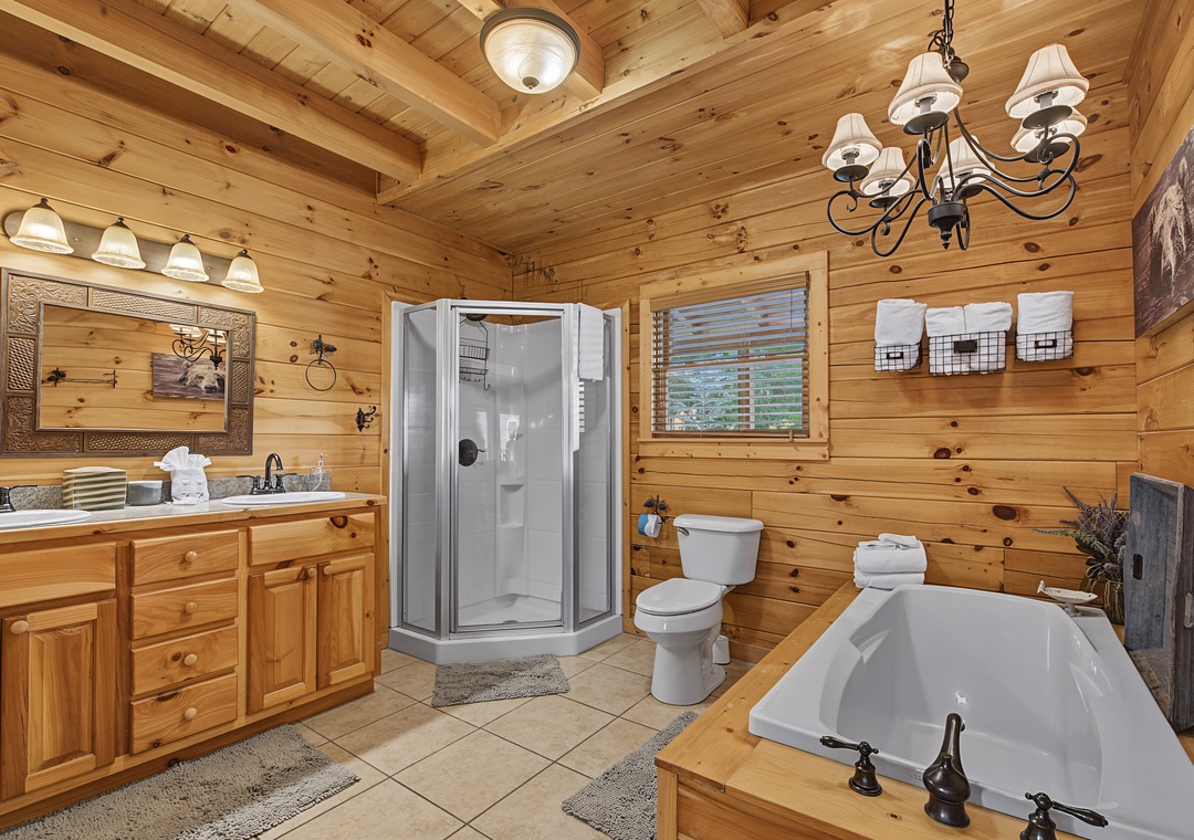 Unwind in your cabin-style bathroom with a soothing soak in the corner tub or refresh in the spacious stand-up shower after a day of mountain adventures.