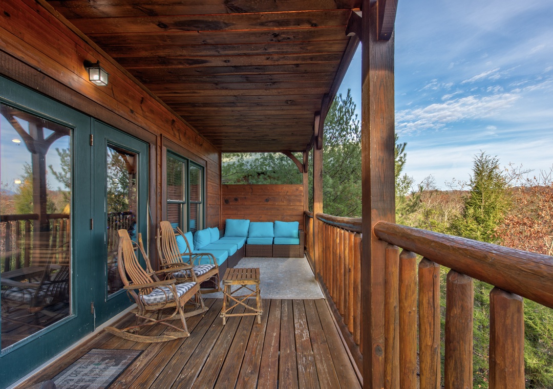 Settle into your private covered deck with comfy seating and sweeping views of the Smoky Mountains. Perfect for morning coffee or peaceful evenings watching the trees sway below.