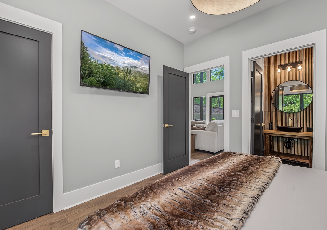 Step into your stylish retreat with modern gray tones, warm wood accents, and natural light welcoming you through thoughtful design touches at every turn.