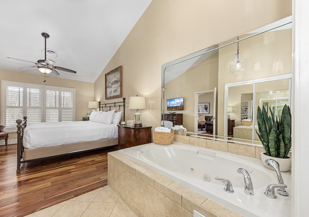 Unwind in your luxurious master suite featuring a spacious soaking tub, perfect for relaxing after exploring the area.