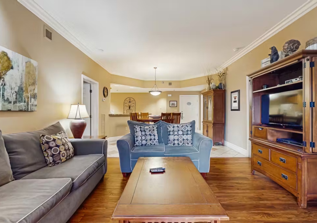 Sink into plush sofas and unwind in your spacious living room, where warm hardwood floors and thoughtful décor create the perfect atmosphere for relaxing evenings together.