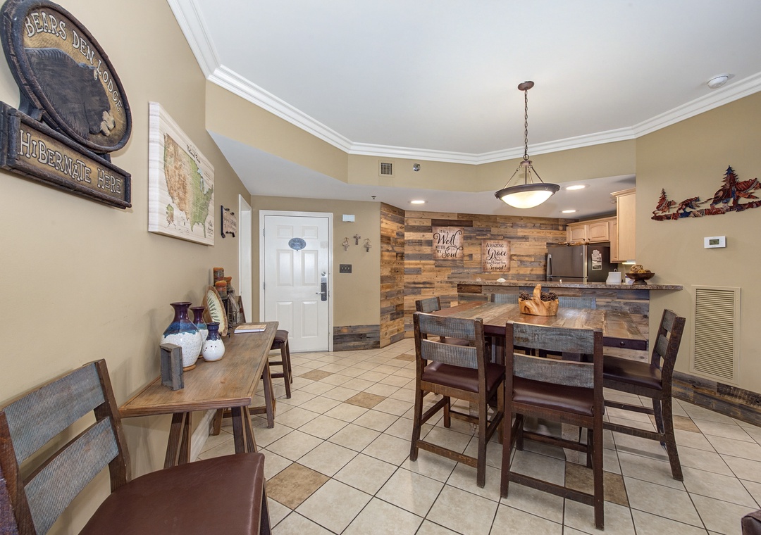 Gather around the spacious dining area where rustic wood accents and granite counters create your perfect mountain retreat.