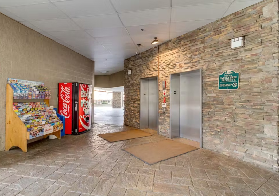 Modern lobby with convenient elevators and vending machines for snacks during your stay.