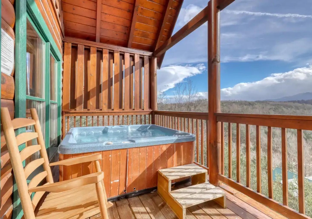 Unwind in your private hot tub on this covered deck, where expansive mountain views stretch as far as the eye can see. The peaceful surroundings invite you to relax completely.