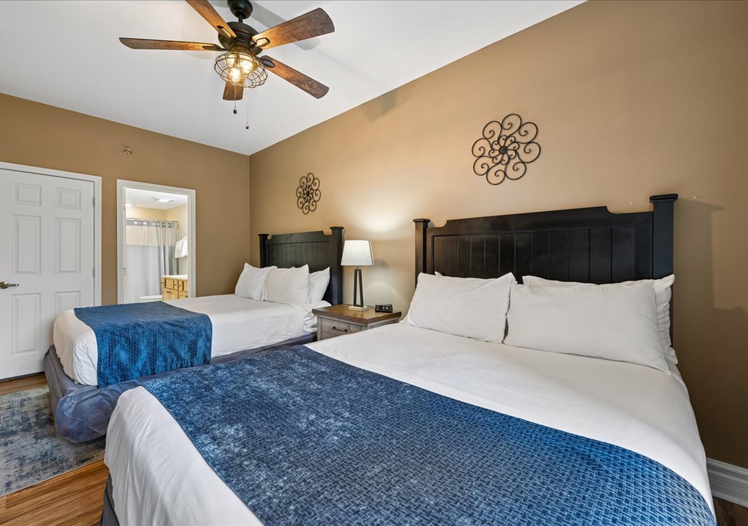 Drift off in your peaceful twin bed sanctuary with crisp linens and a gentle ceiling fan breeze.