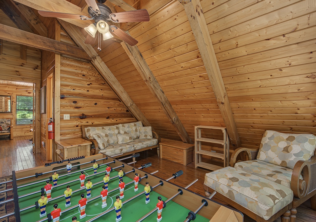 Your retreat features a cozy game loft with soaring timber ceilings, foosball table, and relaxed seating—perfect for friendly competition and unwinding together.