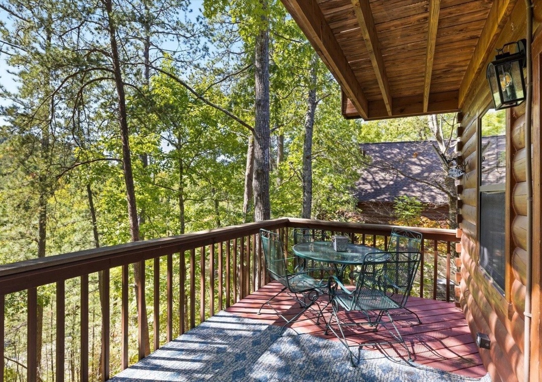 Step onto your private forest deck where morning coffee and forest breezes await at your intimate table for two.