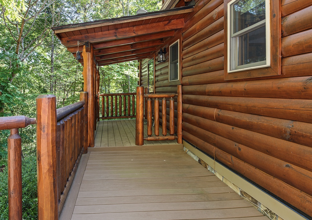 This charming log cabin is nestled in a peaceful wooded setting, offering a covered deck where you can relax and soak in the natural surroundings.