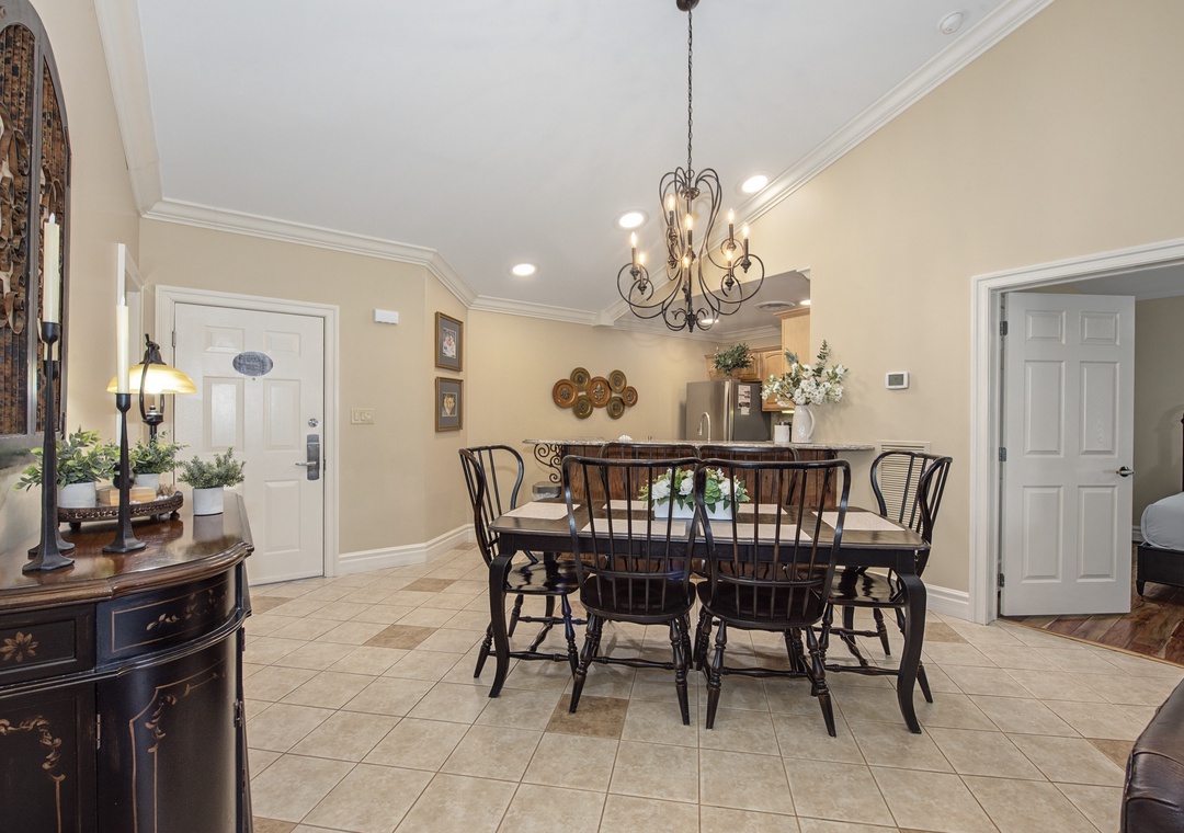 Gather around your elegant dining table where warm lighting and classic decor create the perfect setting for memorable meals together.