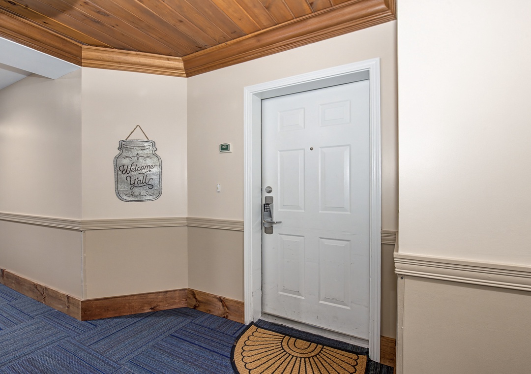 Step into your welcoming entryway with beautiful wood-paneled ceilings and charming mason jar wall decor greeting you home.