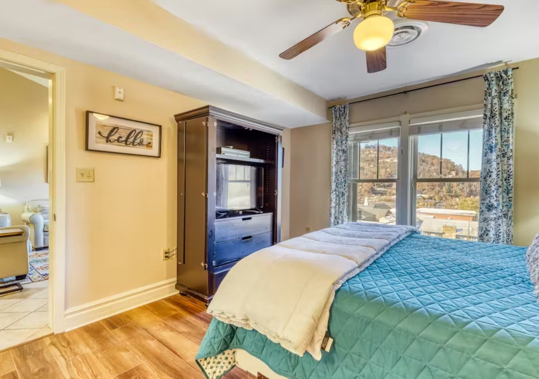 Sink into comfort in your peaceful bedroom with stunning natural views framing your window and warm touches throughout.